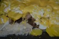 Рыба, запеченная в сметане, с картофелем и грибами