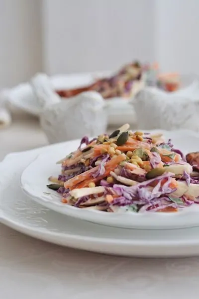 Салат из трех видов капусты с орехами и изюмом