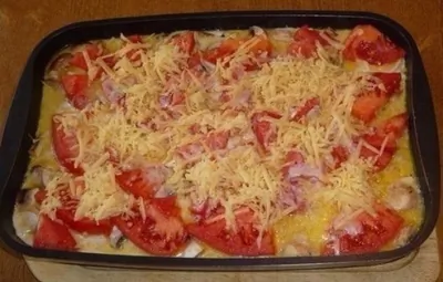 Свинина, запеченная с овощами под соусом бешамель