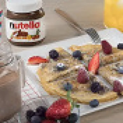 Ажурные блины с Nutella® и ягодами