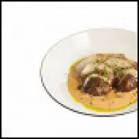 Запеченный топинамбур с луковым соусом