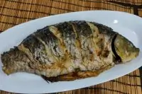 Карп запеченный в духовке